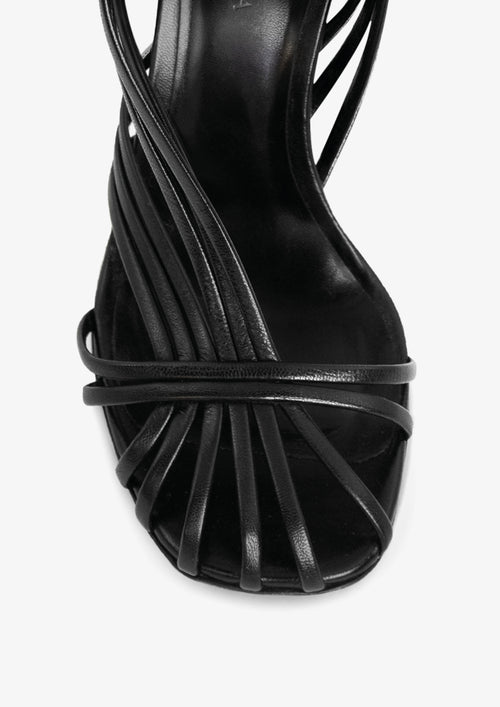 Cadra 100 Sandal by Boutashkova, strappy leather sandal in black, shiny leather on a white background.