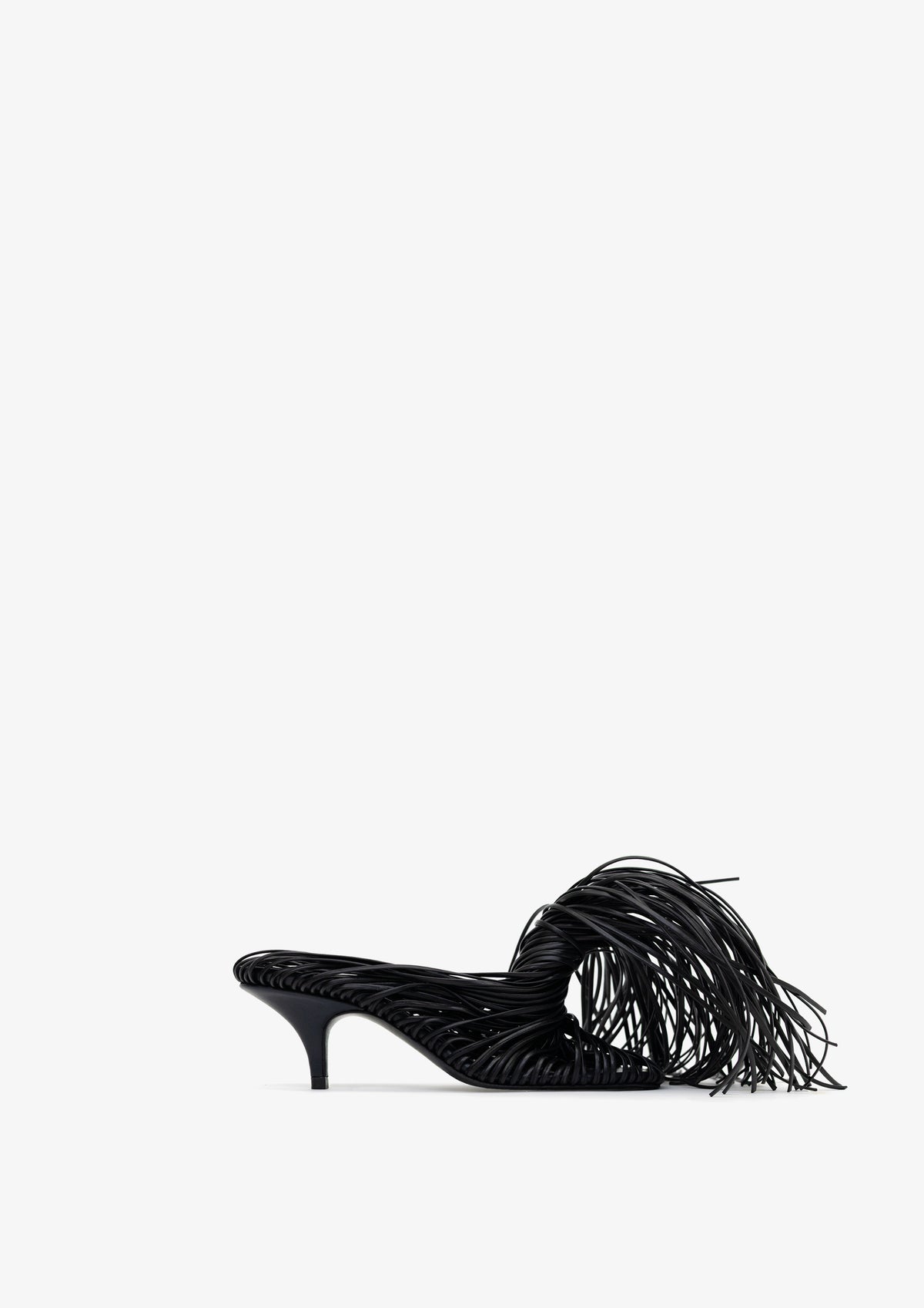 Fringe 60 sandal by Boutashkova, a single black high-heeled mule sandal with an intricate fringed strap design, shown from a side profile against a solid white background.