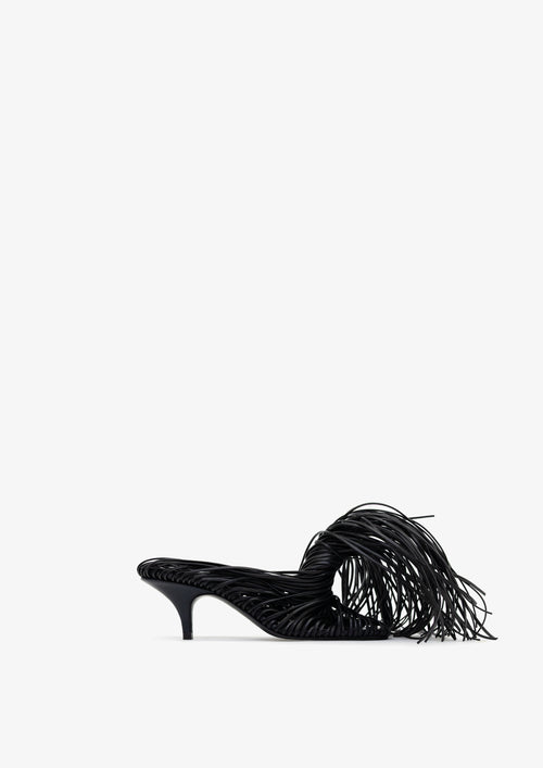 Fringe 60 sandal by Boutashkova, a single black high-heeled mule sandal with an intricate fringed strap design, shown from a side profile against a solid white background.