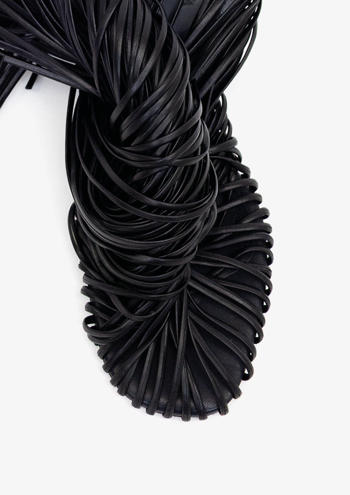 Fringe 60 sandal by Boutashkova, a single black high-heeled mule sandal with an intricate fringed strap design, shown from a side profile against a solid white background.